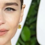 Emilia Clarke poses at an event