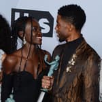 Lupita Nyong’o and Chadwick Boseman smiling