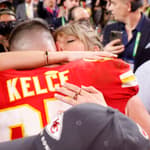 Taylor Swift embraces beau Travis Kelce after the Kansas City Chiefs win the super bowl