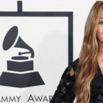 Beyoncé posing in a black dress during a previous Grammys red carpet event.