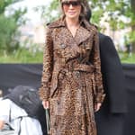 Lisa Rinna posing outside in a coat.