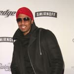 Nick Cannon posing on the red carpet.