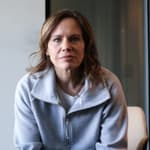 Jennifer Sey sitting on a chair