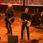 FIREROSE, Billy Ray Cyrus and Travis Denning performing on stage