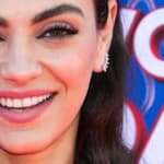 Mila Kunis smiles close up