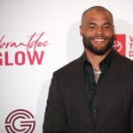 Dak Prescott posing on the red carpet.