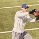 Brock Bowers catching football for Greatness Wins campaign