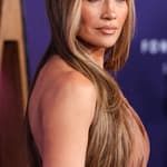 Jennifer Lopez wearing Defaience poses at the 2025 American Music Awards
