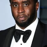 Photo of Diddy posing on the red carpet.