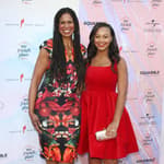 Nia Sioux posing with her mother, Dr. Holly Frazier, on the red carpet.