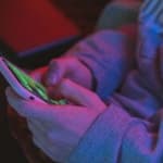 Person typing on their phone