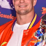 Rob Gronkowski posing on the red carpet.