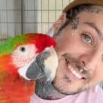 Tyler Nolan and a parrot