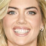 Kate Upton smiles at an event