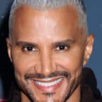 Jay Manuel posing on the red carpet.