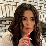 Selena Gomez drinking a milk shake