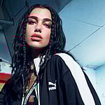 Dua Lipa rocks fishnets for Puma