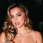 Addison Rae in all white with her mouth open