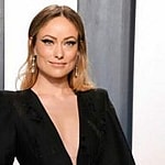 Olivia Wilde looks gorgeous in this v-neck shaped black dress.