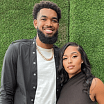 Karl & Jordyn in front of a green wall