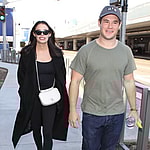 Adam devine and girlfriend Chloe Bridges arrive to LAX after trip to Hawaii
