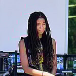 Willow Smith hydrates herself with an energy drink and throws it away into the trash recycle bin after a grocery store visit with her pooch and friends in Calabasas CA