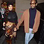 Cardi B shows some serious leg dressed in fishnets and a french beret with boyfriend Offset in Paris