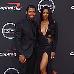 Russell Wilson and Ciara smiling.