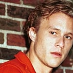 A photo showing Heath Ledger in a red T-shirt.