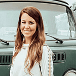 Jana Duggar in front of VW van