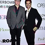 Bob Saget and John Stamos smiling.