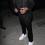 Comedian Dave Chappelle is all dressed up as he leaves the Nice Guy restaurant in West Hollywood.
