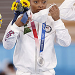 Simone Biles of the United States puts on a mask for protection against the coronavirus after photo shoots during the medal ceremony of the Tokyo Olympic women's artistic gymnastics team competition on July 27, 2021, at Ariake Gymnastics Centre. The United States took silver. (Kyodo)==Kyodo Newscom/(Mega Agency TagID: kyodowc295990.jpg) [Photo via Mega Agency]