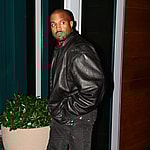 Kanye West is back in his boots as he makes his way around Miami