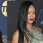 Jada Pinkett Smith and Rihanna smiling.