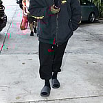 Kanye West is seen for the first time since becoming legally single as he hits up a tattoo shop in Miami