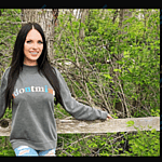 Danielle Ruhl posing on a trail