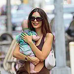 Emily Ratajkowski is all smiling while carrying her Baby as they taking a stroll with husband Sebastian Bear-McClard in NYC