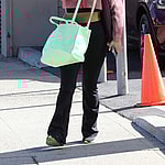 Cheryl Burke all smiles with lighter hair as she heads in for practice