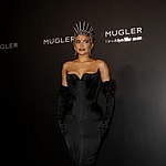 Kylie Jenner can barely walk wearing a one of a kind skin tight apos Mugler apos dress to the exhibition opening in New York City