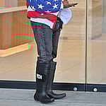 Kanye West heads to a meeting after heading to church wearing an American flag jacket