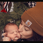 Tia Booth kisses her son