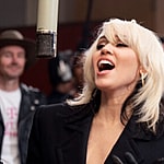 Miley Cyrus urges fans to Do it for the phones as she sings in T-Mobile Super Bowl commercial