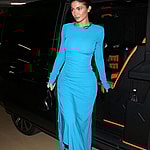 Kylie Jenner shows off her incredible figure in an electric blue Givenchy dress and boots as she arrived back at her Paris Hotel