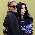 Alexander Edwards and girlfriend Cher arrive at the Versace Fall/Winter 2023 Fashion Show