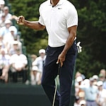 Tiger Woods reacts after making a birdie putt on the 15th hole during the first round of theMasters Tournament at Augusta National Golf Club