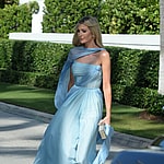 Ivanka Tump wears a flowing baby blue dress as she arrives to sister Tiffany Trump's wedding at Mar-A-Lago in Palm Beach
