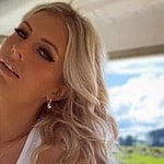 Farmer and OnlyFans star Brittney Woods poses for the camera.