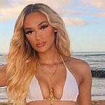 Savannah Tucker poses for the camera in her bikini and jeans while at the beach.
