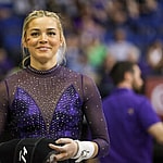 March 8, 2024: LSU's Olivia Dunne smiles to a fan during the Purple and Gold Podium Challenge woman's gymnastics quad meet at the Raising Canes River Center in Baton Rouge, LA. Jonathan Mailhes/CSM (Credit Image: © Jonathan Mailhes/Cal Sport Media) Newscom/(Mega Agency TagID: csmphotothree239106.jpg) [Photo via Mega Agency]